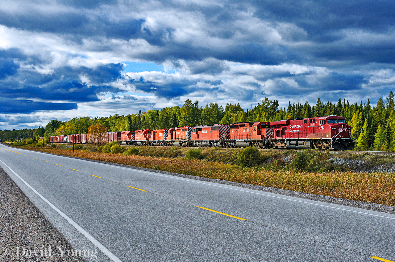 A quartet of scrap bound locomotives had me heading up to the "Raith Flats" to capture Winnipeg-Toronto freight 222-17. Seen rolling alongside Highway 17 between Savanne and Raith around Mile 64,  getting up to speed after a meet with a westbound hotshot at Savanne, CP 8792-6079-9021 led the train with CP SD40-2 5713- GP9u 1585- SD40-2 5700- 5721 dead in trail, presumably headed for scrap.