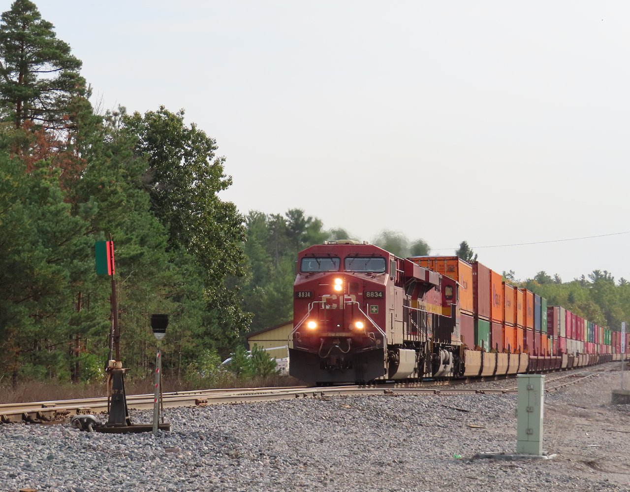 A northbound intermodal is about to pound the switch of the spur track at Midhurst. Up until 2011 Midhurst had a siding and a couple of back tracks seeing occasional use. Today the back tracks sit disconnected and lying under a huge pile of used crossties.