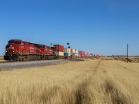 CPKC 119 gets up to trackspeed, after climbing out of the South Saskatchewan River Valley and a crew change in Medicine Hat. 