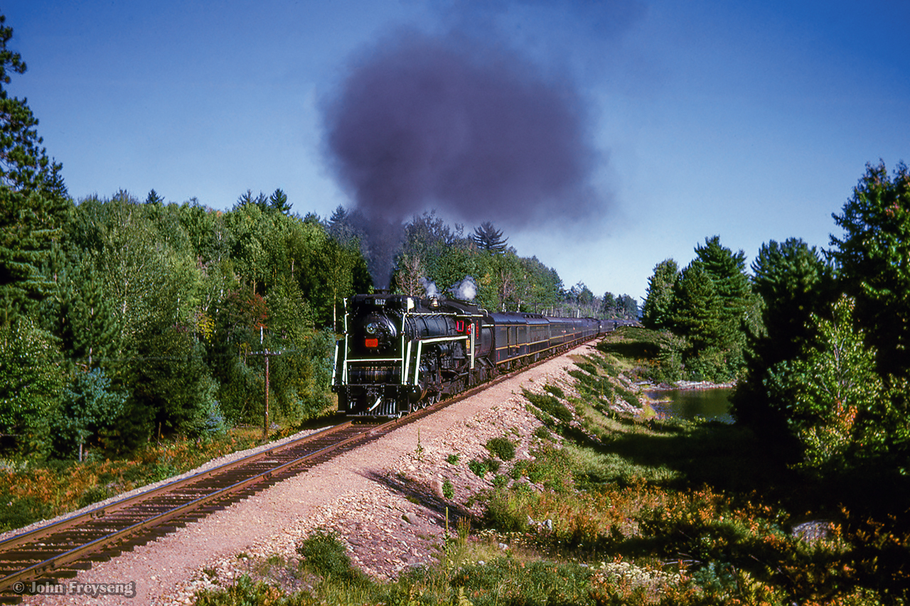 CNR 6167 leads a runby near mile 127 of the Beachburg subdivision, about four miles west of Achray (mile 123), as the UCRS special from Ottawa to North Bay cuts across the wilds of northern Ontario.

The weekend of September 13 - 15, 1963 marked a massive undertaking by the Upper Canada Railway Society, a 692.2 mile excursion from Toronto - Ottawa - North Bay - Temagami - Toronto, with seventeen coaches behind CNR 6167. With the train having run overnight from Toronto - Ottawa on the 13th, the train turned west and departed the nation's capital early on the 14th. 6167 would be removed at North Bay, with ONR FP7s 1521 and 1511 handling the train to Temagami overnight. The consist returned to North Bay on the morning of the 16th, with 6167 taking over once again for the return to Toronto.

Further information will be detailed in upcoming posts, but can also be found in the December 1963 UCRS news letter.

Scan and editing by Jacob Patterson.