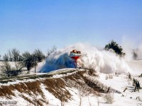 After meeting <a href=https://www.railpictures.ca/?attachment_id=50657>the Teeswater Sub wayfreight at Grand Valley,</a> plow extra 8424 west approaches Arthur.  The location is not exact, however the culvert is likely just east of Sideroad 7.<br><br><i>Scan and editing by Jacob Patterson.</i>