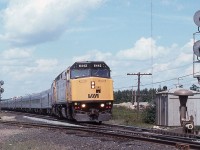 After a GREAT meet with a short northbound freight where neither train stopped, VIA Train #2 pulls out of the south end of the siding at Suez, Ontario in August 1998.  VIA 6442 leads the 21 car this day.