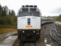 <b> Up close and personal </b> <br>
From the rear vestibule of VIA 8224 Chateau Roberval sleeper on VIA 693 The Hudson Bay, sits VIA 691 The Hudson Bay tucked into the station track just a couple of car lengths back at Thompson, MB Mile 30.5 HBRY Thompson Sub. <br>
Both trains are getting a headend crew change and full service on this overcast and rainy September 18, 2024 afternoon. <br>
photo edited by Benny