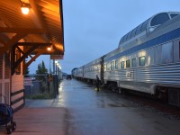 <b> ALL ABOARD </b> <br>
Skyline car attendant Sean stands by the step box at the vestibule door of economy coach VIA 8130 at the Churchill station waiting for the last of the economy class passengers to board VIA 692 The Hudson Bay. <br>
The baggage truck can be seen driving down the platform after loading all the luggage and supplies for the southbound journey. <br>
I enjoyed a full day in the town of Churchill, and the rain was kind enough to hold off until a half hour before boarding.
The consist for this evenings train is: <br>
VIA 6419 locomotive <br>
VIA 6433 locomotive <br>
VIA 8602 baggage car <br>
VIA 8118 economy coach <br>
VIA 8130 economy coach <br>
VIA 8511 Skyline dome <br>
VIA 8224 Chateau Roberval sleeping car