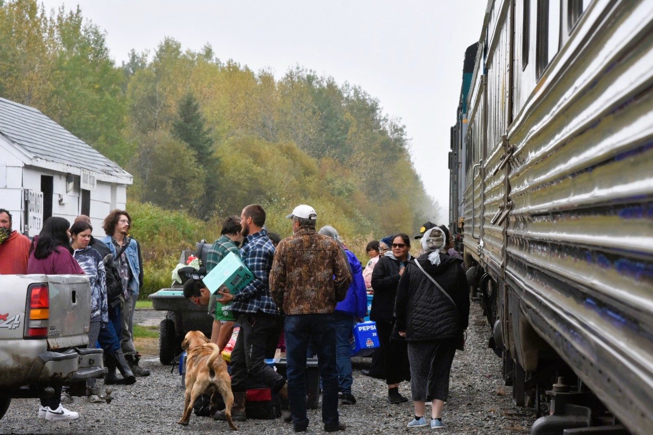 Hey everyone, the train is here!  
VIA 692 The Hudson Bay has arrived at Thicket Portage, MB on a cool and misty September 20, 2024 afternoon and the town folk have gathered to pick up groceries and other supplies. 
Even the town pooch is excited to participate in the event. :-) 
 https://www.manitoba.ca/inr/publications/community_profiles/pubs/thicket-portage-2016.pdf >>>