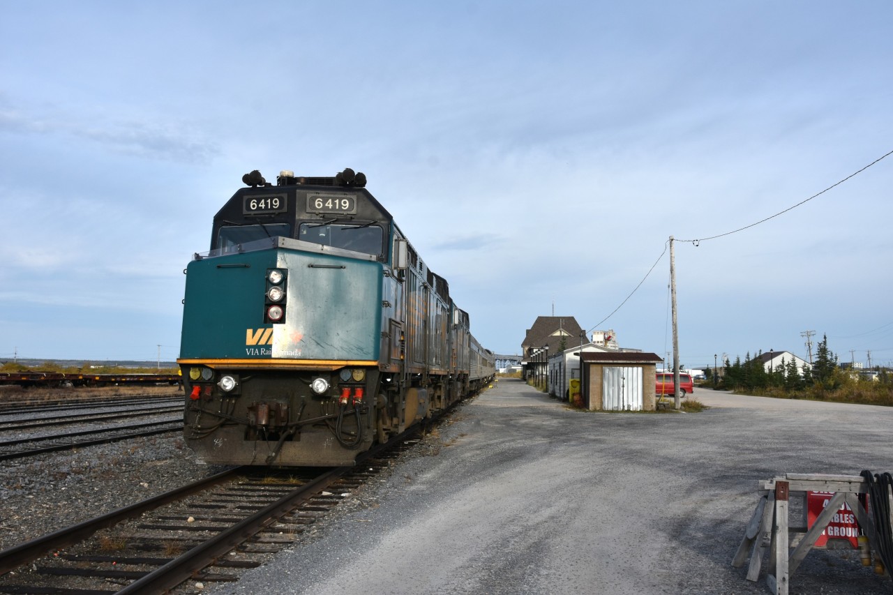 Standing by  
VIA 693 The Hudson Bay has backed into the station track at Churchill, passengers have detrained, baggage has been unloaded, and all but one of the local shuttle vans has departed. 
VIA 6419 & VIA 6433 have not been plugged into wayside power and will idle away for the entire day.
This same consist will depart at 19:30 hrs. this same day as VIA 692 The Hudson Bay destined for Winnipeg. 
It's shaping up to be a beautiful day to wander the town.