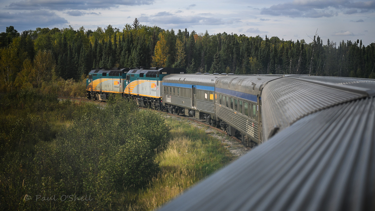 Wye it's sunny!  
A nice burst of sunshine breaks through the overcast sky to light up VIA 693 The Hudson Bay on the north leg of the wye at Mile 0.0 of HBR's Thompson Sub. on a warm September 18, 2024 afternoon. 
Another nicely edited photo by Benny :-)