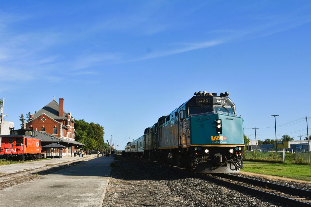 Stately Manor   
The VIA station/Railway Museum at Dauphin is an imposing structure that has been beautifully preserved. 
After departing Winnipeg, this first scheduled stop for VIA 693 The Hudson Bay offers passengers an opportunity to stretch their legs and enjoy a beautiful afternoon on the platform and surrounding area. 
Unknown at this point in the journey was that the lead unit VIA 6433 would be switched out to the trailing position this evening at The Pas, MB due to a radio failure, making us 6+ hours late the next morning.