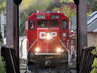 On its way to Havelock and the nepheline syenite mine at Blue Mountain, CP train T08 crosses the Otonabee River bridge in downtown Peterborough, on October 9th, 2024. 