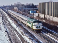 <br>
<br>
EMD on GO: Former Milwaukee #104A, a 1952 EMD built FP7A, rebuilt to GO APCU #911 leads an eastbound, 
<br>
<br>
powered by GO 725, former Rock Island #380 ( ex RI #3004) a 1967 EMD built GP40-M-2,
<br>
<br>
At CN Scarborough Junction,  
<br>
<br>
With the NIKKOR 135mm f2.8 AI manual focus lens;  February 12, 1983 Kodachrome by S.Danko
<br>
<br>
     <a href="http://www.railpictures.ca/?attachment_id=  36646 ">  MILW 104A  </a>
<br>
<br>
sdfourty

