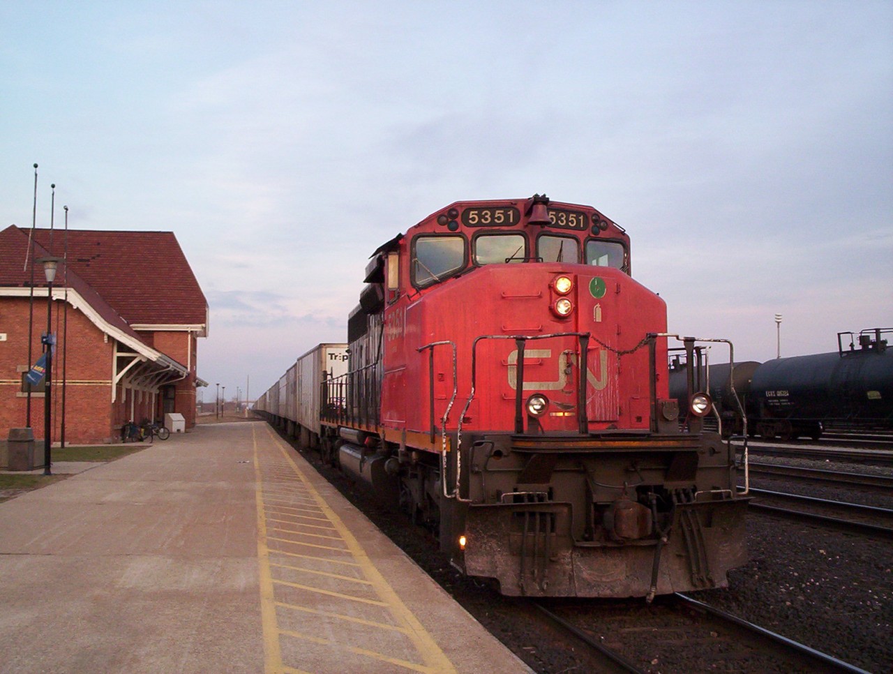 CN SD40-2W 5351 with the daily westbound roadrailer train 145 pauses at the station at Sarnia, roadrailer 145 and eastbound counterpart 144 would often meet at Sarnia for crew changes.