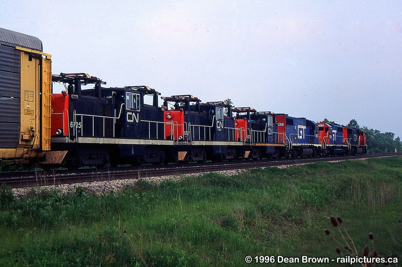 CN 333 had CN SD70I 5607, GTW SD40-2 5936, GTW GP38-2 5851, and three CN Z-5-A 6725, CN 6726, and CN 6727 in tow being shipped from Montreal to New York.