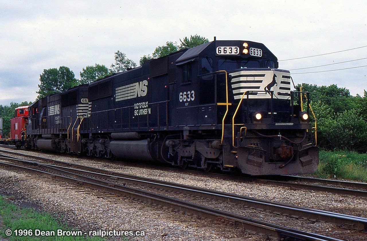 NS 445 with NS 6633 and NS 6679 on the siding at Dain waiting to get their train built by CN.