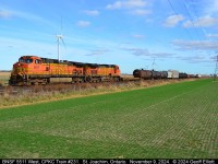 With winter wheat popping up now a pair of BNSF GE's lead CPKC Train #231 across the CPKC Windsor Subdivision at MP 88.0 on November 9, 2024.  This pair had been running east out of London on the 238/239 trains to/from Welland but were changed out with 231's power in London this morning to my benefit.  :-)