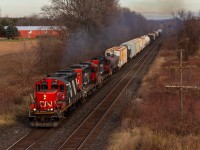 One of 14 zebra GP9RMs left on CN's roster (5 in the Toronto pool) leads a rare trio of GP9RMs westbound as they highball down the Dundas sub after running around their train at Paris Junction. This particular trio was CN 4131, CN 7025, and CN 4136; who collectively had 198 years of service at the time the photo was taken. To my knowledge, there has not been another GP9 trio in London in the year since, although some wacky sets including 3 GP9s have occurred a bit to the north in the Kitchener terminal. 