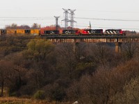 Not something I was expecting to see the other day whilst rolling the dice with CN was the daily Brampton-turn L559 heading back to Mac Yard with a rare quartet of majority GP9s crossing the Humber River. I had actually been waiting for 4125-9555 on L529 coming back from the Highbury spur so the zebra stripes on the leader instinctively looked like exactly what I was looking for, until confusion hit my face seeing 2 more GP9s emerge from the descent from Martin Grove. Ultimately, 4130-9449-7270-7032 made up the consist, the pair of back-to-back duos implied that the second half was lifted from Brampton IMS as they are fitted for the standard use of RCL by BIT yard. 
<br> <br>
The debate I'm having with myself right now which I'll open up to the floor is whether or not the crew aboard 7032 is evidence to the contrary and this quartet originated in Mac or if they took a lunch right after lifting the power. Also worth noting the exhaust coming out of the two GP9s, but I don't think that's quite as compelling as 559 could've needed the extra help and borrowed power from BIT.