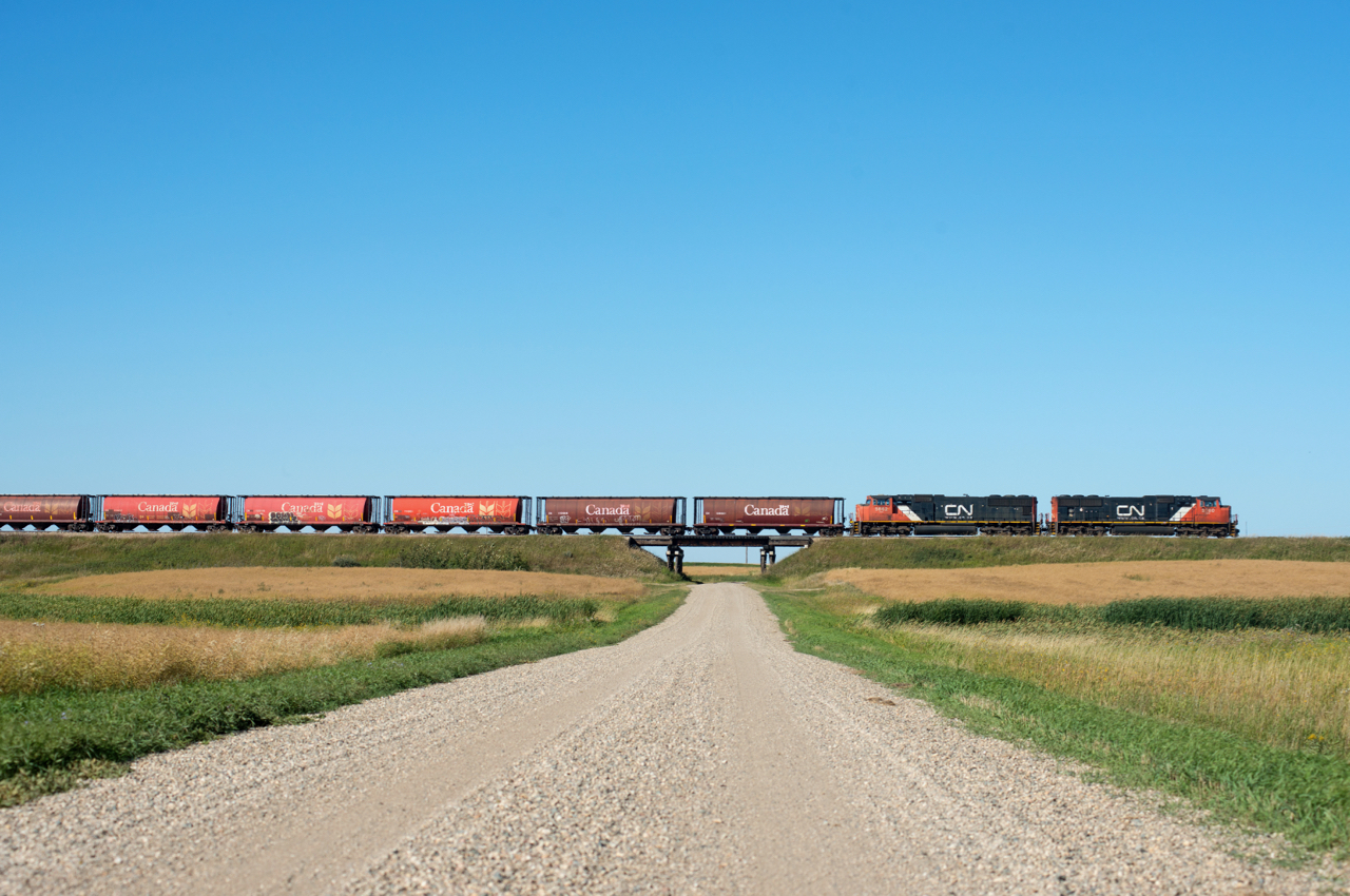 CN 508 slowly trundles it's way along the Glenavon Subdivision with a sharp looking block of exGovernment grain cars up front.