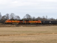 You never really know what might happen. The long story....two days ago, Toronto-Detroit 135 (CP BNSF)had the CP engine fail around Milton. BNSF 4066 was dispatched from London or Ayr where it had been the power on empty rack train 734. At some point after that, 238's 2 CP GE's that were sitting in London were put on 135...or it's return 134. No idea what happened to the failed CP, but the 2 BNSF's were left to power 238 from London to Welland. 

Which gets us to their return trip to London...in terrible light, so I gambled on 1/20th in the wind and tried to pan. In an mostly GE world, you try to find things to keep it interesting. 