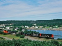 
<br>
<br>
<br>
<br>
….......…........…......The Rock.............................
<br>
<br>
<br>
<br>
<br>
<br>

Wednesday only TT #206 rolls through Southern Bay, enroute to Bonavista, at 09:35 on August 4, 1982, Kodachrome by S.Danko  
<br>
<br>

Consist: 
<br>
<br>

TT #205 G-8 #802-801 – two loads of pipe -coach #754 – caboose #6061
