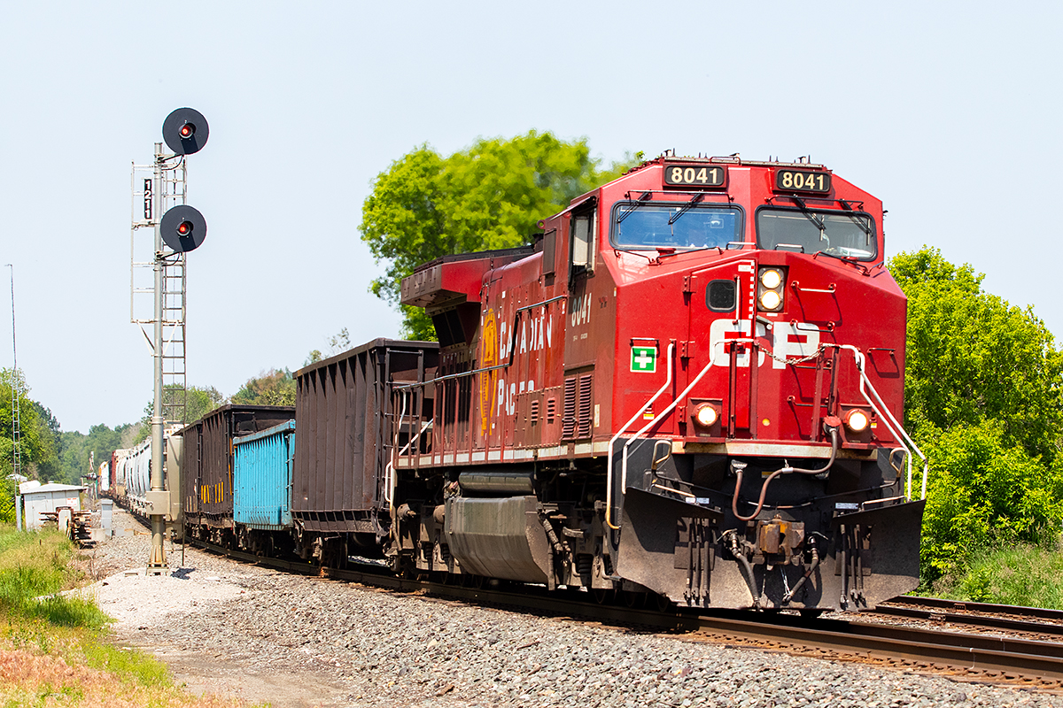 CP 8041 leads an eastbound through the quiet farm fields and forest of southeastern Ontario.