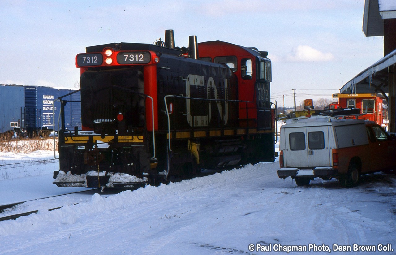 CN 549 with CN SW1200RS 7312 behind the old Merritton Station.