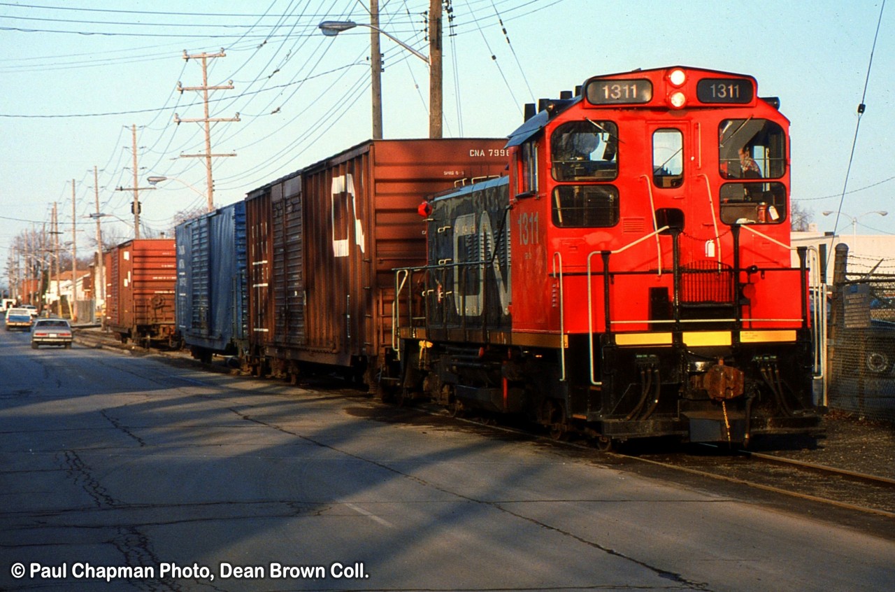 CN 550 with CN SW1200RS 1311 at GM Ontario Street Plant on Carlton St switching the plant.