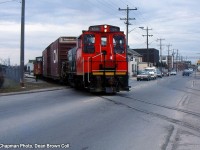 CN 549 with CN SW1200RS 1311 heads southbound leaving GM Ontario St. plant.