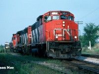 During a summer evening, CN train 421 is seen performing it’s work at the Kitchener yard with GP40-2L(W) 9511, another GP40-2L(W) and a GP9RM. The GP9RM was either set-off in the yard or continued to Stratford or London.  Also, there appears to be a dimensional load behind the power that possibly originated from Babcock & Wilcox on the CN Fergus Spur.