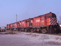 The outbound power for an eastbound train head around the shop area at Agincourt Yard on October 21st, 1979.  Four C424s: 4240 4237 4206 4242 and RS-18: 8770 make up the consist.  The first and third units have had their grills swapped out from the other side of the units messing up the multi-mark logo.