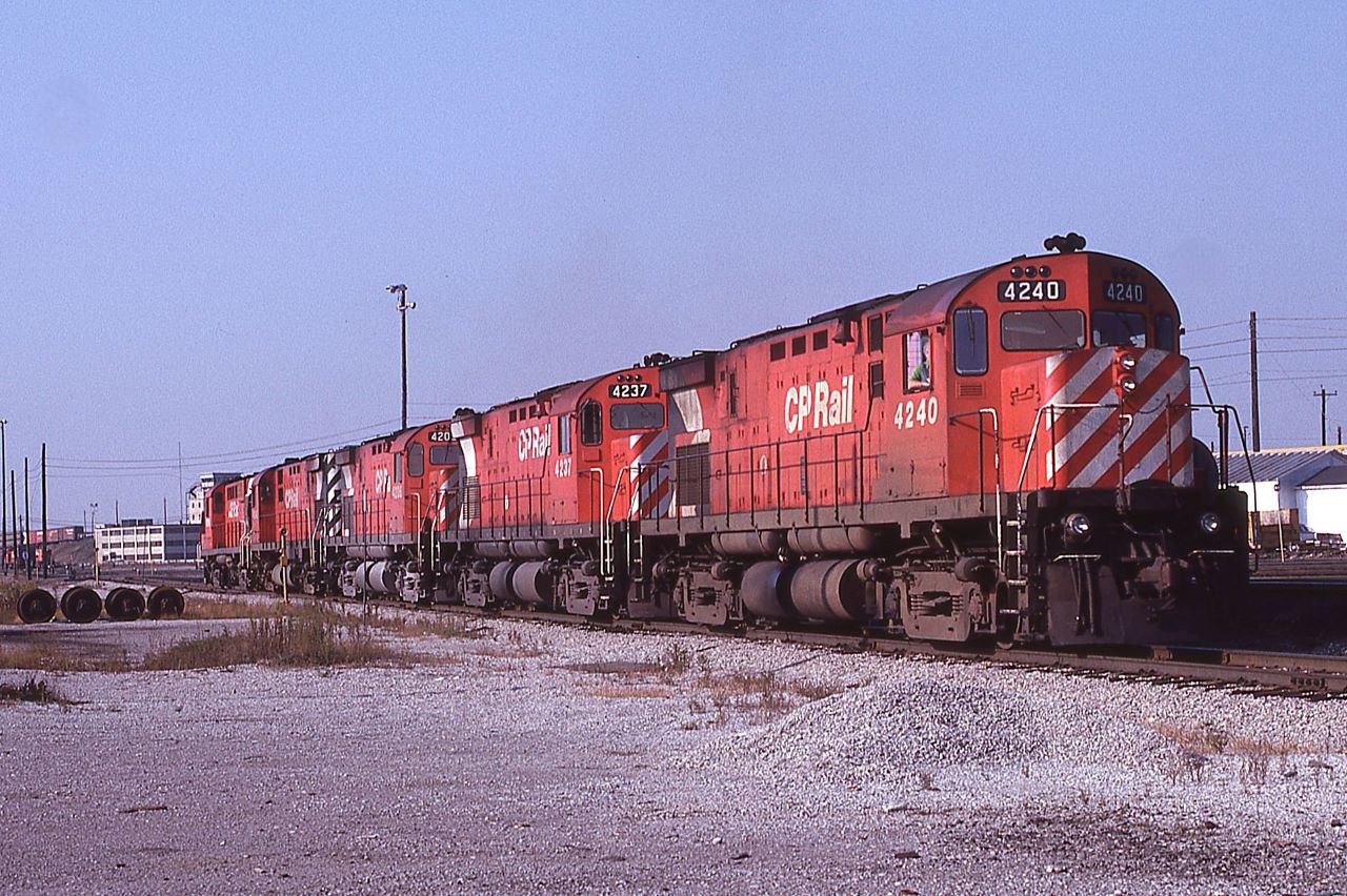 The outbound power for an eastbound train head around the shop area at Agincourt Yard on October 21st, 1979.  Four C424s: 4240 4237 4206 4242 and RS-18: 8770 make up the consist.  The first and third units have had their grills swapped out from the other side of the units messing up the multi-mark logo.