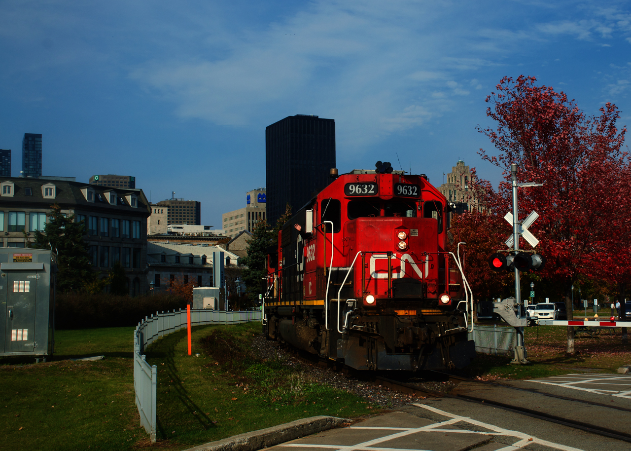 A crewmember waves as CN 500 leaves the Port of Montreal.