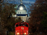 The dome of Bonsecours Market looms above as CN 9677 leads CN 500 out of the port.