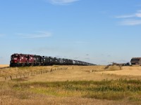 A gas train had just departed Leader, SK and is about half way to the hamlet of Mendham when we caught up with it. The train is on the way to Burstall, another 23 miles down the line where it will work an energy facility there.  Track speed is 10 MPH. Power consists of FURX 5519 (with Great Sandhills decal on side) HLCX 1031 and a former NS 5543; a unit which I saw on Wheatland Rwy a couple of years previous.
The location I shot this at I believe is Township Rd 220, and we are about 2 miles out of Leader, the hub for the GSR.
I was under the impression short lines did not work weekends, yet here it is a Sunday and there were trains operating on both ends of the roughly 130 mile line.  Busy times !!