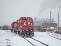 CP TH11 pulls into Strathearne Yard to lift gons of scrap from AIM under a decent snowfall.