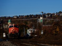 CN 322 in Montreal, with Mount Royal in the background.