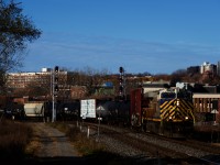 After setting off cars near Turcot Ouest, CN 322 is rounding a curve with an ex-CREX leader.