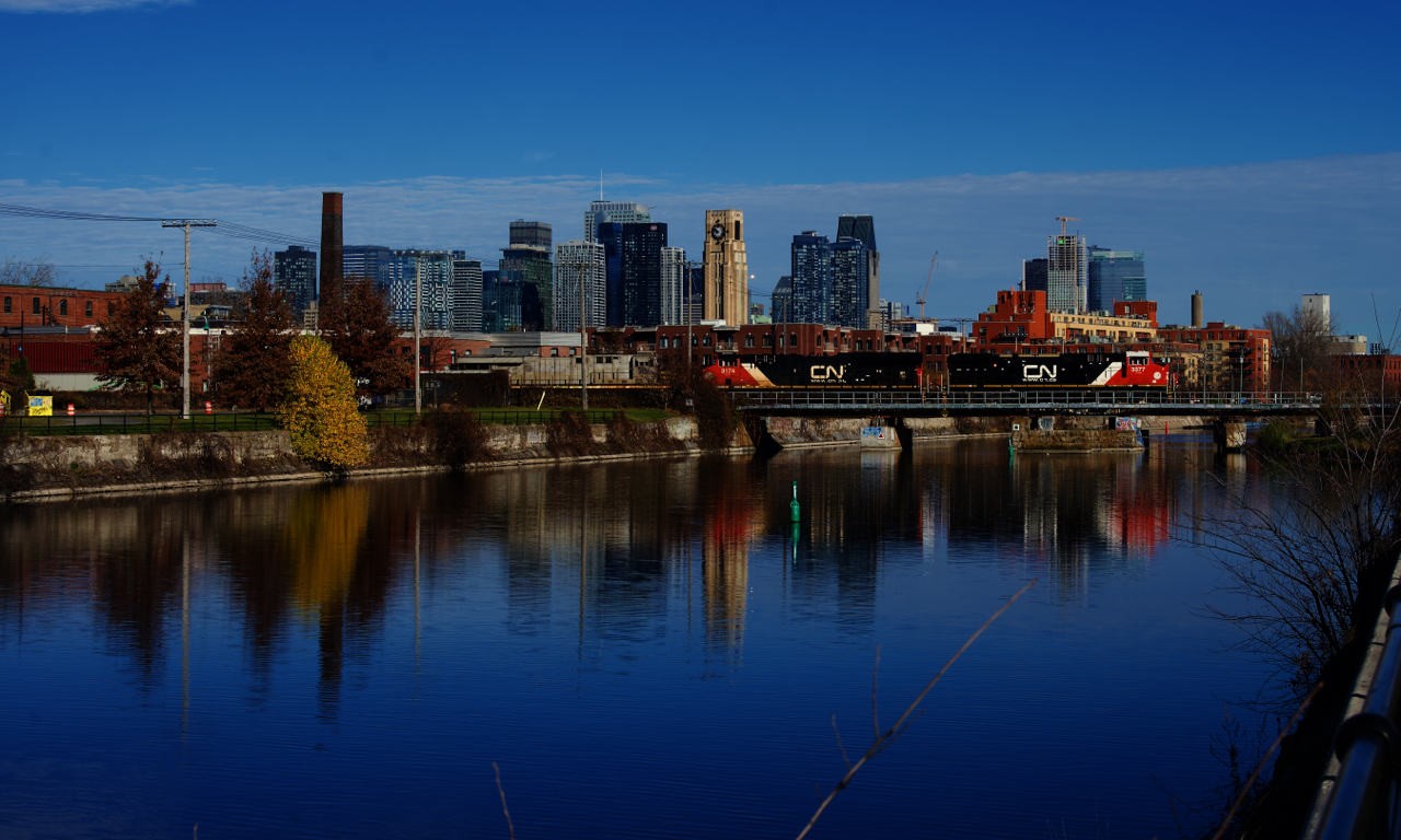 Gleaming CN 3377 leads CN 120 over the Lachine Canal with intermodal traffic for The Maritimes.