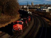 CN 527 is stopped on the Freight Track, as it gets ready to back up and leave cars on Track 29 for an X321. The sun is out on what was supposed to be a completely cloudy day.