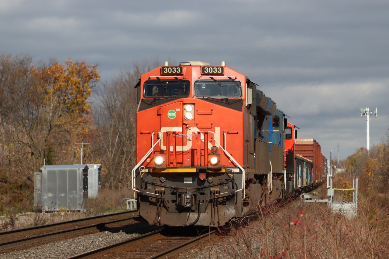 Westbound on the South Track about to cross Mainway, trailing units are GECX 2037 and CN 8307. Congestion on the Oakville Sub. will have this westbound stopping at Burlington West for two eastbound trains heading up the Halton Sub..