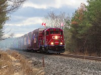 The Holiday Train lays out some exhaust as it accelerates out of Midhurst after a brief stop. A few fans can be seen just to the left of the signal. So far the Barrie area has been spared from the snow, but in another 5 miles the train will be in to it.