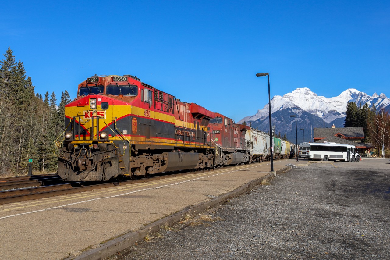 After sitting at Canmore for most of the morning awaiting a recrew, CPKC 303-672 is underway westward leading a parade of four westbounds.  The Southern Belles look great in the Rocky Mountains!