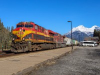 After sitting at Canmore for most of the morning awaiting a recrew, CPKC 303-672 is underway westward leading a parade of four westbounds.  The Southern Belles look great in the Rocky Mountains!