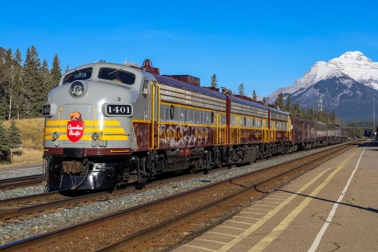 CPKC 21B-30 sits in the siding at Banff for a meet with hotshot 112-29.  Following three tonnage grain trains west, 21B could afford a bit of a delay at Banff to meet 112, by Eldon they would have caught up to the last train before picking up their passengers at Lake Louise for an evening round trip to Banff and back.