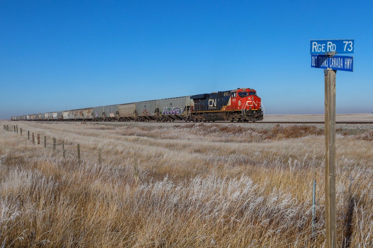 CN 3905 shoves on the rear of CPKC 301, running alongside the Old Tran Canada Highway - which was a quiet dirt road.  On the headend of CPKC 301, was CN 2849 and KCS 4686