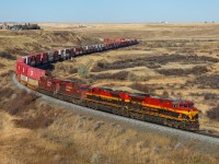 CPKC 118-31 grinds upgrade out of Medicine Hat with a colourful lashup. KCS 5003, KCS 4001, CP 8773 and CP 8752.  The two CP units will come off at Swift Current to power up a grain train. 