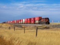 CPKC’s premiere intermodal train 100-01 cruises across the Brooks Sub, departing Bowell - next stop Medicine Hat!