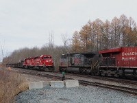 The CWR train sits waiting on the North track at Guelph Junction for CPKC 134 to pass to continue on its way west. I heard that CPKC had a KCS leader but when the grey KCSM 4544 showed I was very happy. An SD40-2 (CPKC 5989)and a KCSM "grey ghost" (KCSM 4544) in one shot. Here, the pair meet just past Milburough Line with the crew of the CWR out for their inspection.