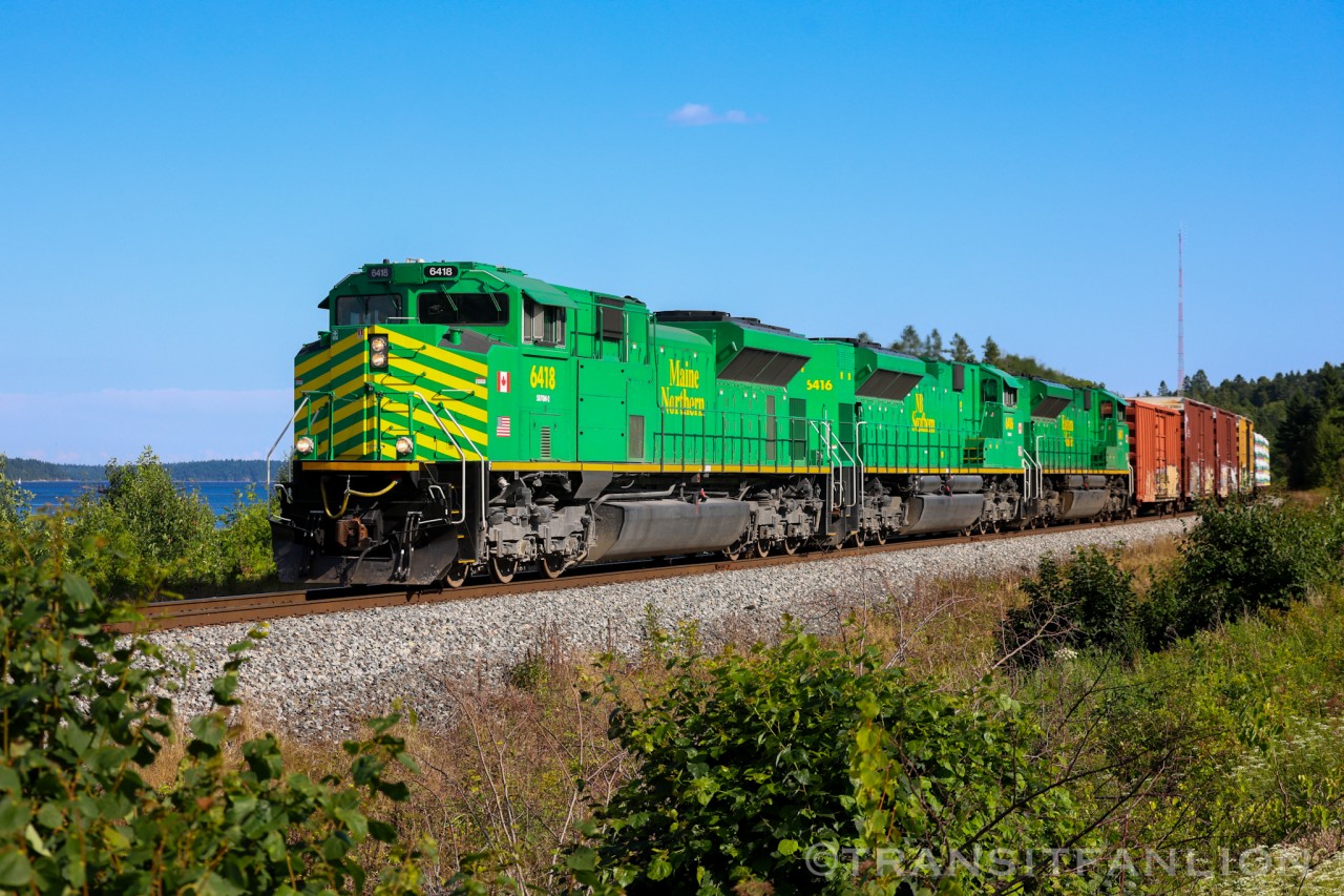 NBSR 6418 leading NBSR 121-07, NBSR 6416 and NBSR 6411 trailing, at Mile 14 McAdam sub.