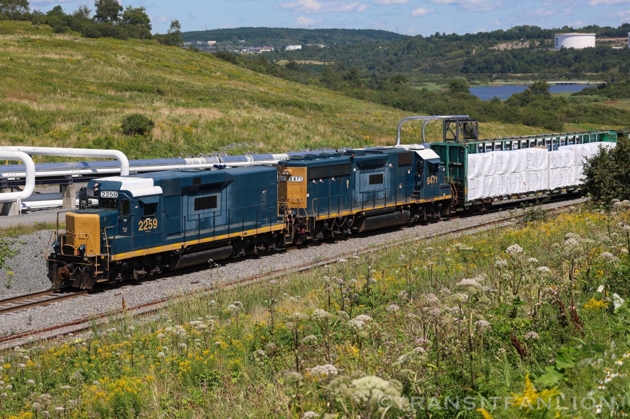 A pair of ex CSX geeps returning to Island yard after switched Irving Paper plant in Saint John East.