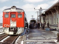 Westbound train 627 from Stratford to Goderich pauses at Clinton, where members of the Royal Canadian Air Force are disembarking for transport to the nearby base.

<br><br><i>Scan and editing by Jacob Patterson.</i>